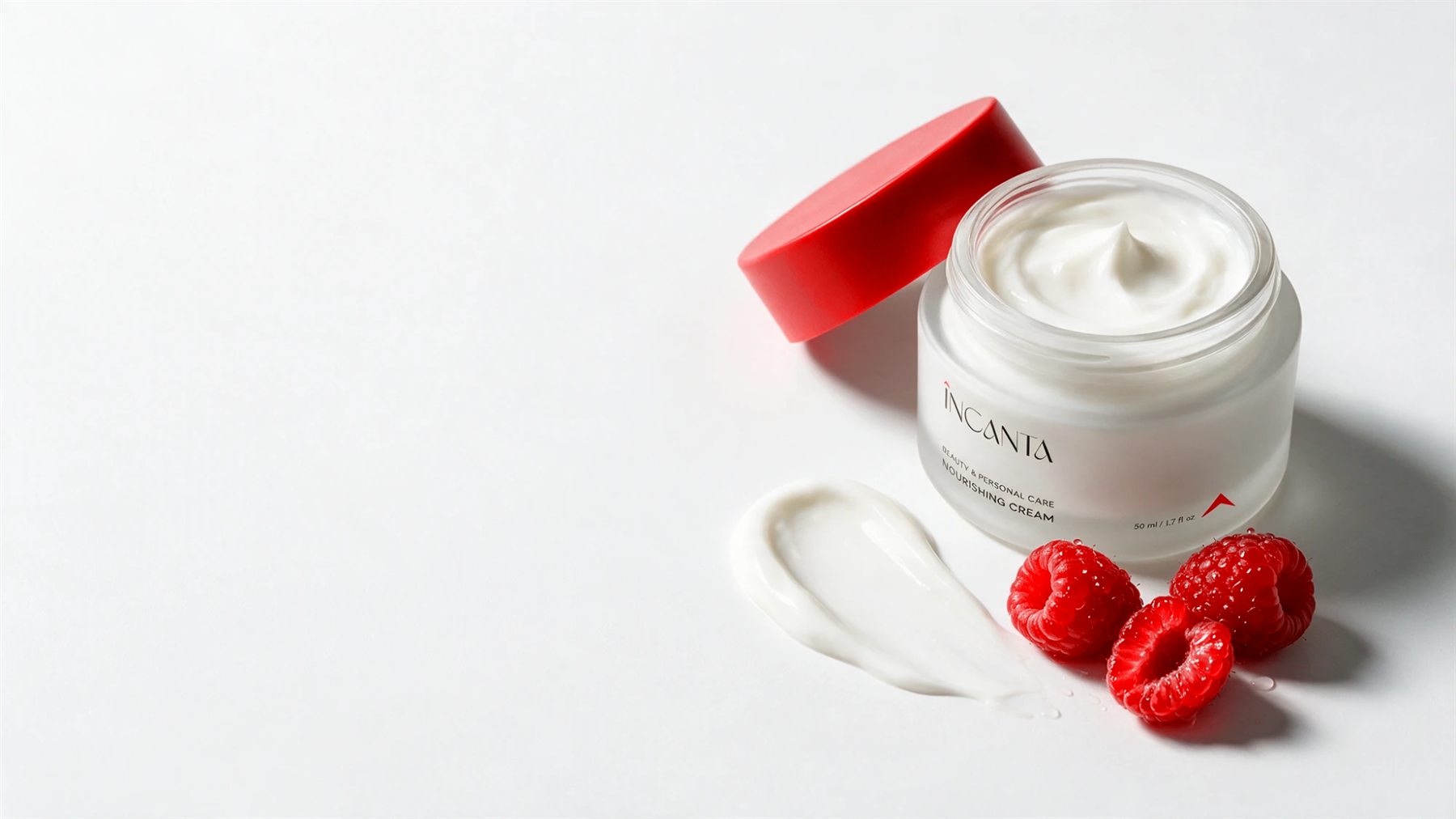 Open ÎNCANTA cream jar with a red lid and fresh raspberries